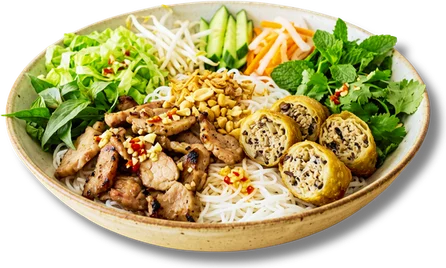 Grilled pork vermicelli bowl with egg roll, herbs and pickles